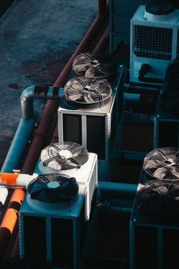 a group of air conditioners sitting next to each other Our expert technicians provide seamless AC installation services, ensuring your new system is set up for optimal performance and energy efficiency. We tailor the installation process to your specific needs, guaranteeing a perfect fit for your home or business. Photo by Kettenreaktion