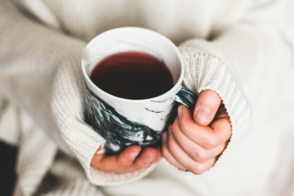 person holding cup of coffee heater issues furnace issues troubleshooting heater issues troubleshooting  furnace issues 