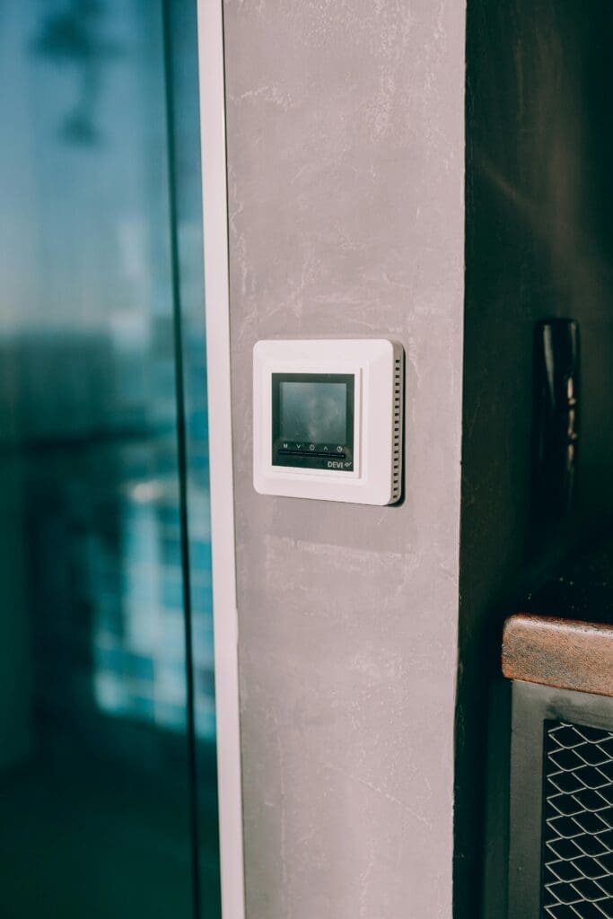 Smart thermostat mounted on a concrete wall, Troubleshooting Bad AC Thermostat 